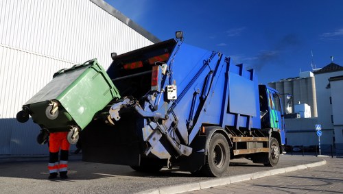 Customer consulting with skip hire professionals